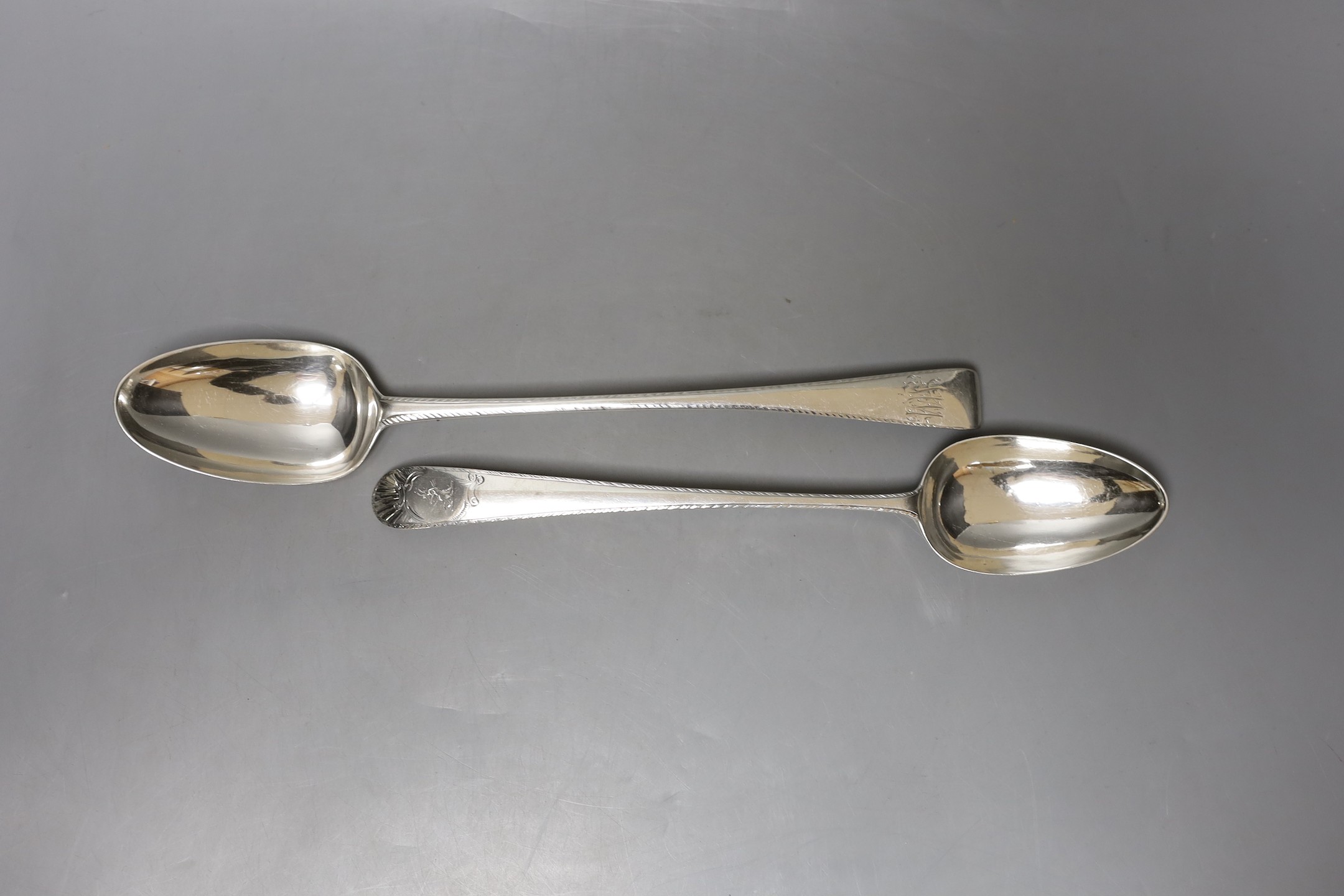 Two late 18th century Irish silver Old English feather edge basting spoons, one by James Keating and one dated Dublin, 1777, largest 31.3cm, 194 grams.